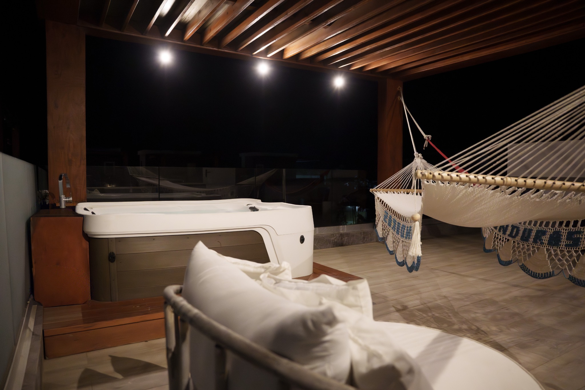 Rooftop hot tub at night after active island days